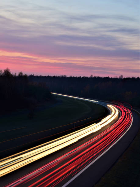 istock cars on highway at night 1077518126