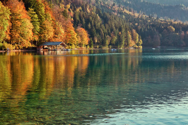 istock Beautiful blue mountain lake on a warm fall season day 1077521082
