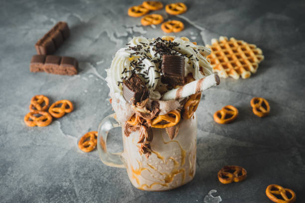 istock Chocolate shake with milk, dripping sauce, cream and cookie 1077526988
