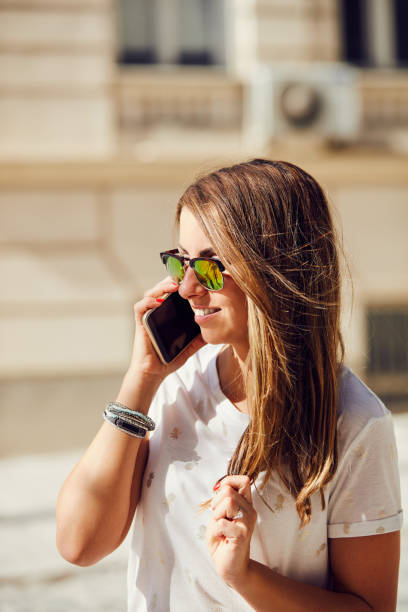 istock Young attractive woman using cellphone in  urban surroundings. 1077529530