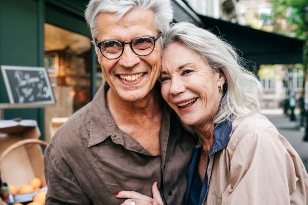 istock Senior couple walking around the city 1077534636