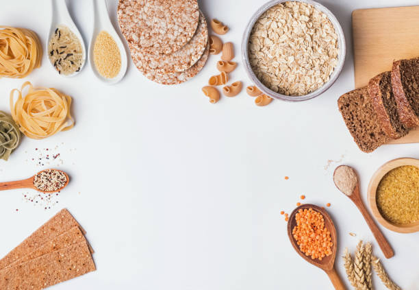 istock Different types of high carbohydrate food on the white background 1077539140