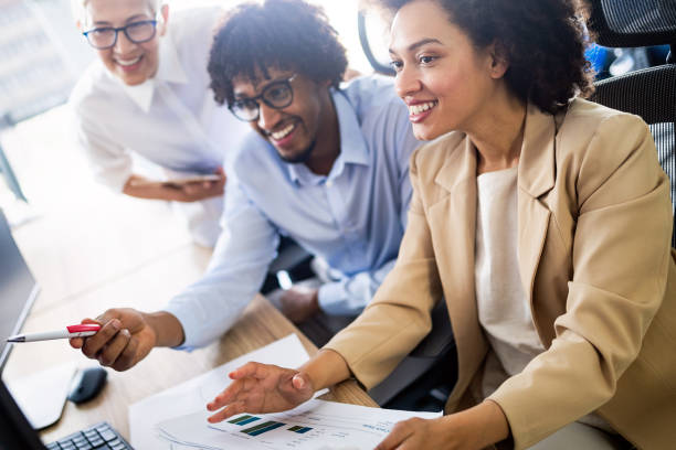 istock Group of successful business people at work in office 1077547080