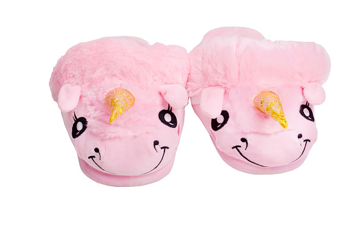 Funny home slippers unicorns isolated on white.