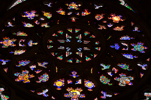 Multi colored stained glass windows inside cathedral