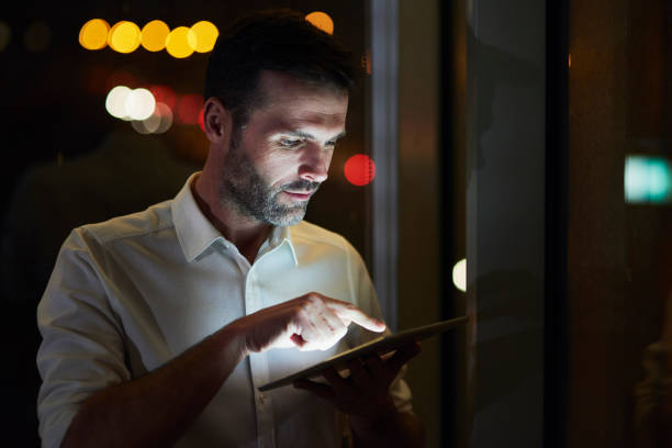 istock Businessman using a tablet in his office 1077553938