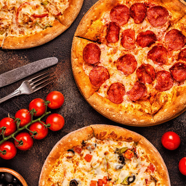 istock Set of different pizzas - pepperoni, vegetarian, chicken with vegetables 1077555326