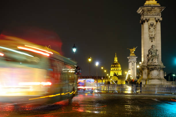 istock Paris night scene with light trails near the champs elyzee. 1077556980