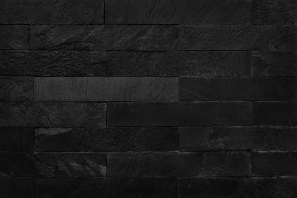 istock Black brick wall texture background. Pattern of slate stone for design art work. 1077559594