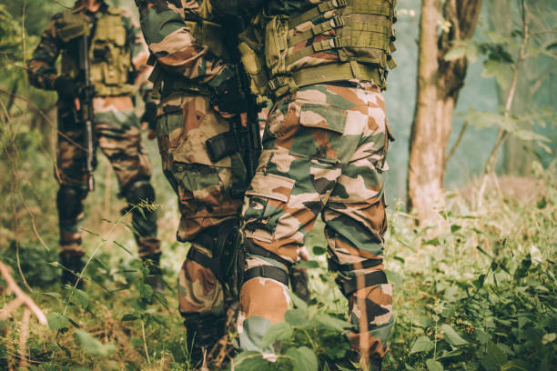 istock Military soldiers in forest 1077563122