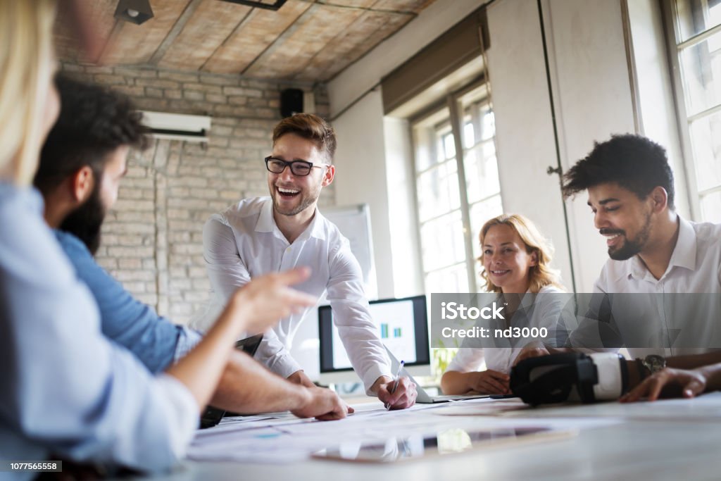 Creative business people working on business project in office Creative young business people working on business project in office Office Stock Photo