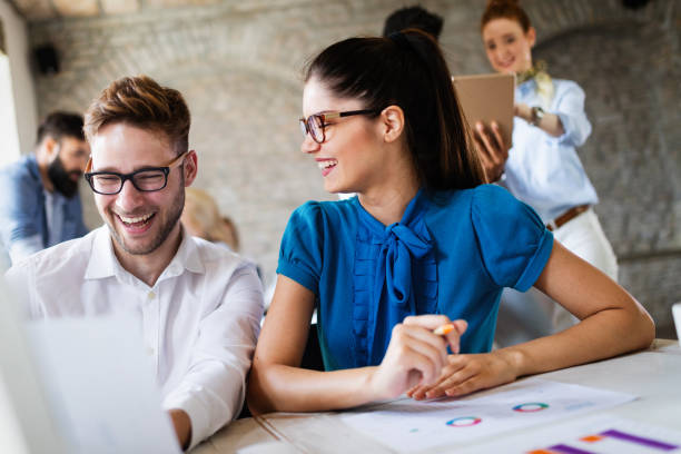 istock Business, technology and people concept - creative team or designers working in office 1077565584