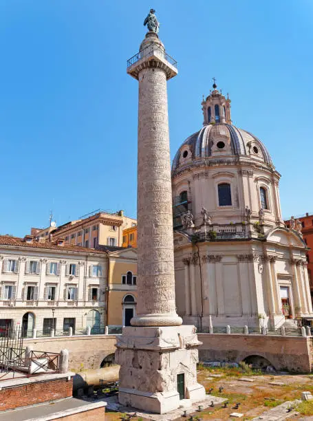 Photo of Trajan's Column and Santa Maria di Loreto church in Rome, Italy