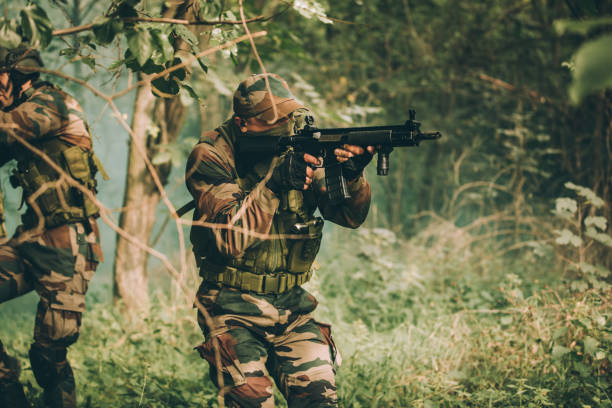 istock Military soldiers in forest 1077567454