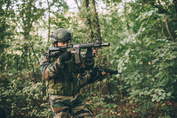 istock Soldiers in forest 1077567572