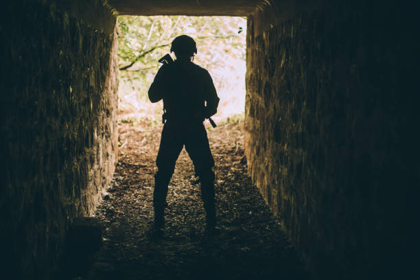 istock Soldier in dark tunnel 1077569216