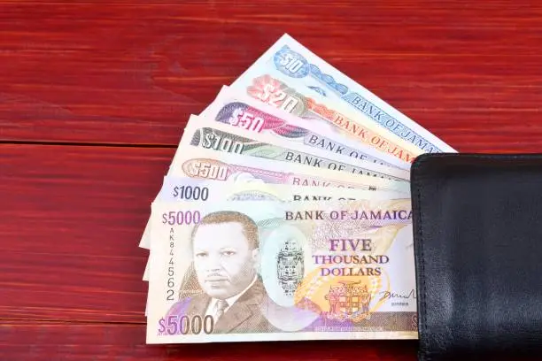 Photo of Jamaican money in the black wallet