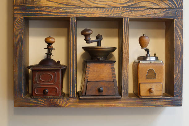istock Coffee grinders on shelve. Retro collection of coffee grinders. 1077571612