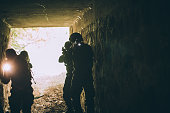 Soldiers in dark cave