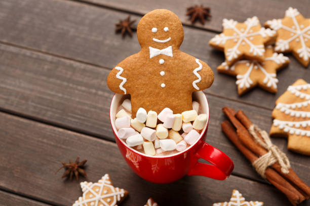 istock Gingerbread cookie in cup of cocoa with marshmallows 1077576906