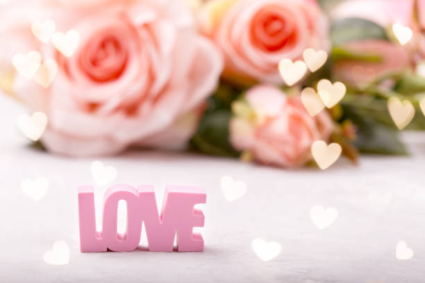 istock Pink roses with word LOVE 1077578196