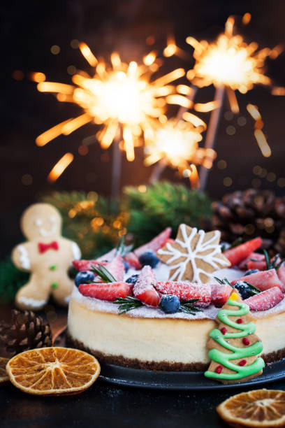 istock Delicious Christmas ginger cheesecake with fresh berries decoration 1077580934
