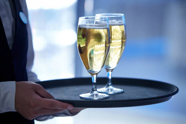 istock The waiter serving champagne 1077581588