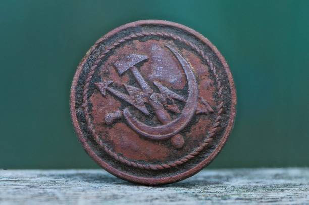 istock old dirty brown soviet electrician button on a gray table 1077590390