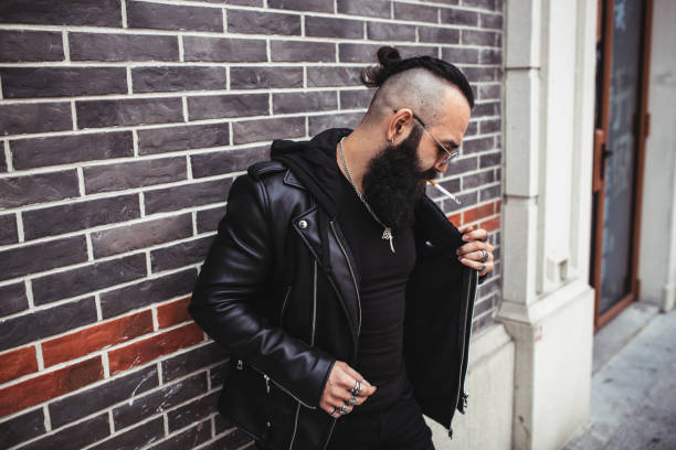 istock Bearded man smoking on the street 1077591128