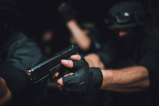 istock Police force man with gun 1077593932