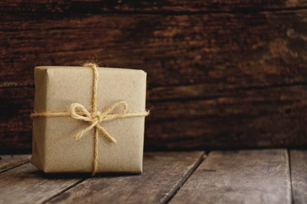 istock Eco friendly gift boxes wrapped with brown paper, green happy new year present concept, copy space 1077598308
