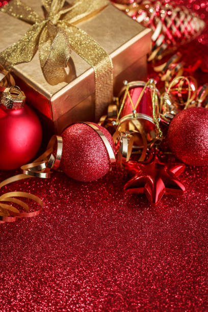istock Christmas composition of Christmas tree toys on a blurred red background 1077599574