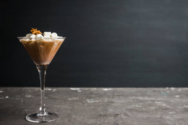 istock Chocolate martini with spices and marshmallow on the rustic background 1077600158