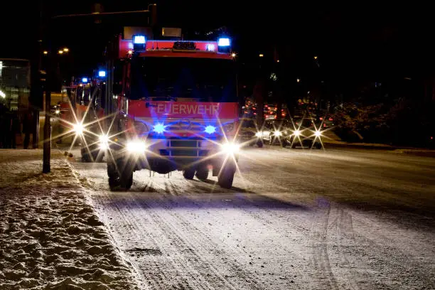 German Firetrucks on an icy road - night shot