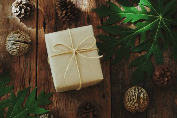 istock Eco friendly gift boxes wrapped with brown paper, green happy new year present concept, copy space 1077604618