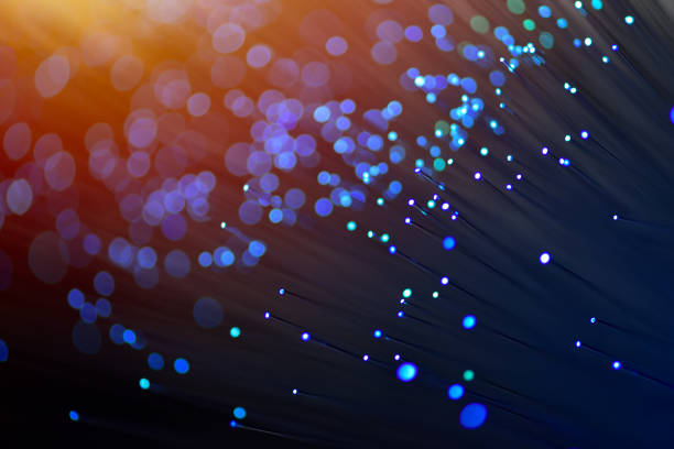 istock Fiber optics in blue, close up with bokeh, warm lens flare 1077605080