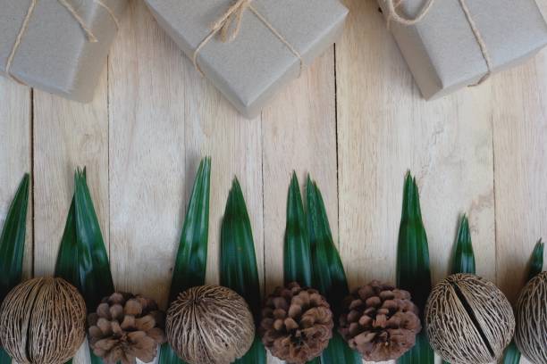 Eco friendly gift boxes wrapped with brown paper, green happy new year present concept, copy space