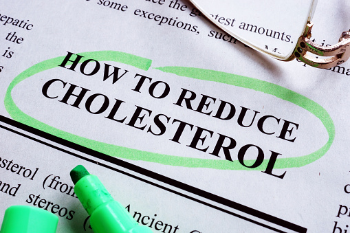 Inscription How to reduce cholesterol is underlined by a marker.