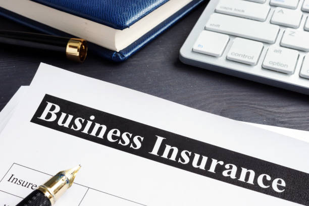 istock Business insurance policy and pen on a desk. 1077607092