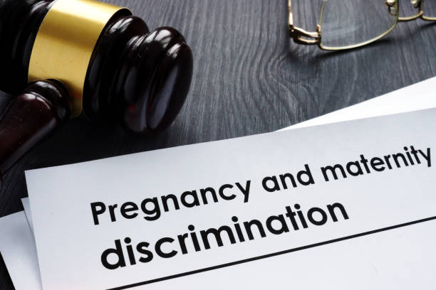 istock Documents about pregnancy and maternity discrimination and gavel. 1077607200