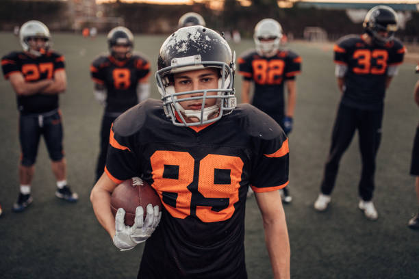 istock Football team on field 1077608476