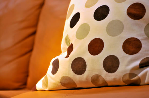 istock Colorful cushions on couch in home 1077614956