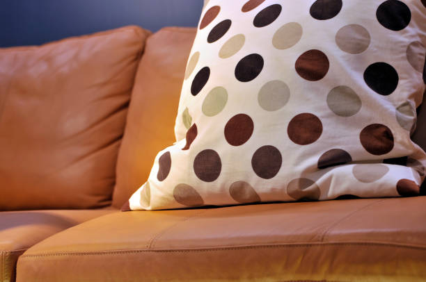 istock Colorful cushions on couch in home 1077614960