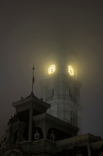 Clock tower of Philadelphia City Hall in fog, Pennsylvania, USA