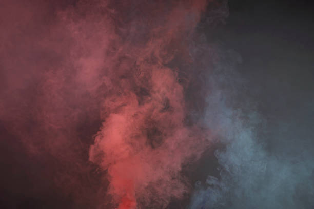 istock colorful smoke on dark background 1077620324