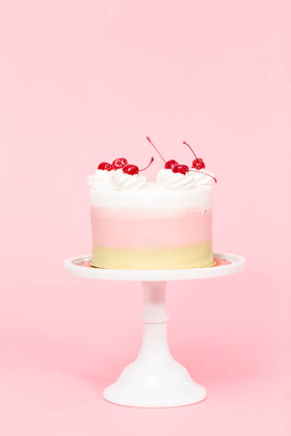 istock Birthday Spumoni cake on pink background. 1077620640