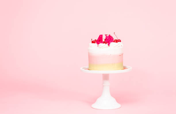 istock Birthday Spumoni cake on pink background. 1077620826