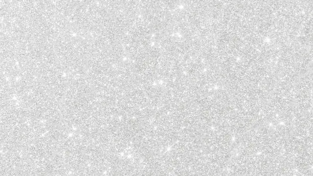 Silver glitter texture white sparkling shiny wrapping paper background for Christmas holiday seasonal wallpaper decoration, greeting and wedding invitation card design element
