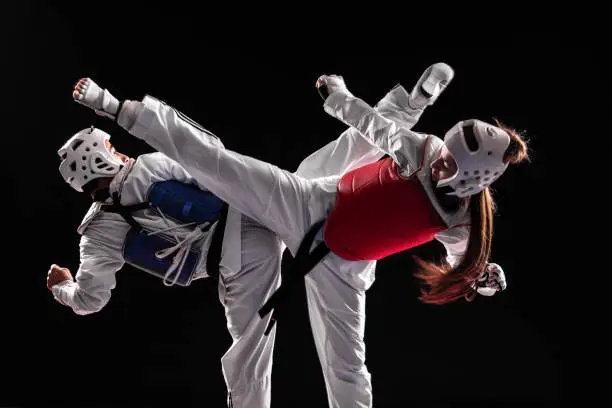 Photo of Man and woman taekwondo combat