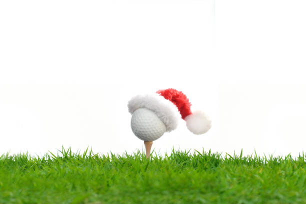 istock Festive-looking golf ball on tee with Santa Claus' hat on top 1077630568